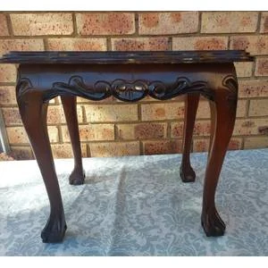 AN ANTIQUE RECTANGULAR SOLID WOOD BALL N CLAW LEGGED OCCASIONAL TABLE