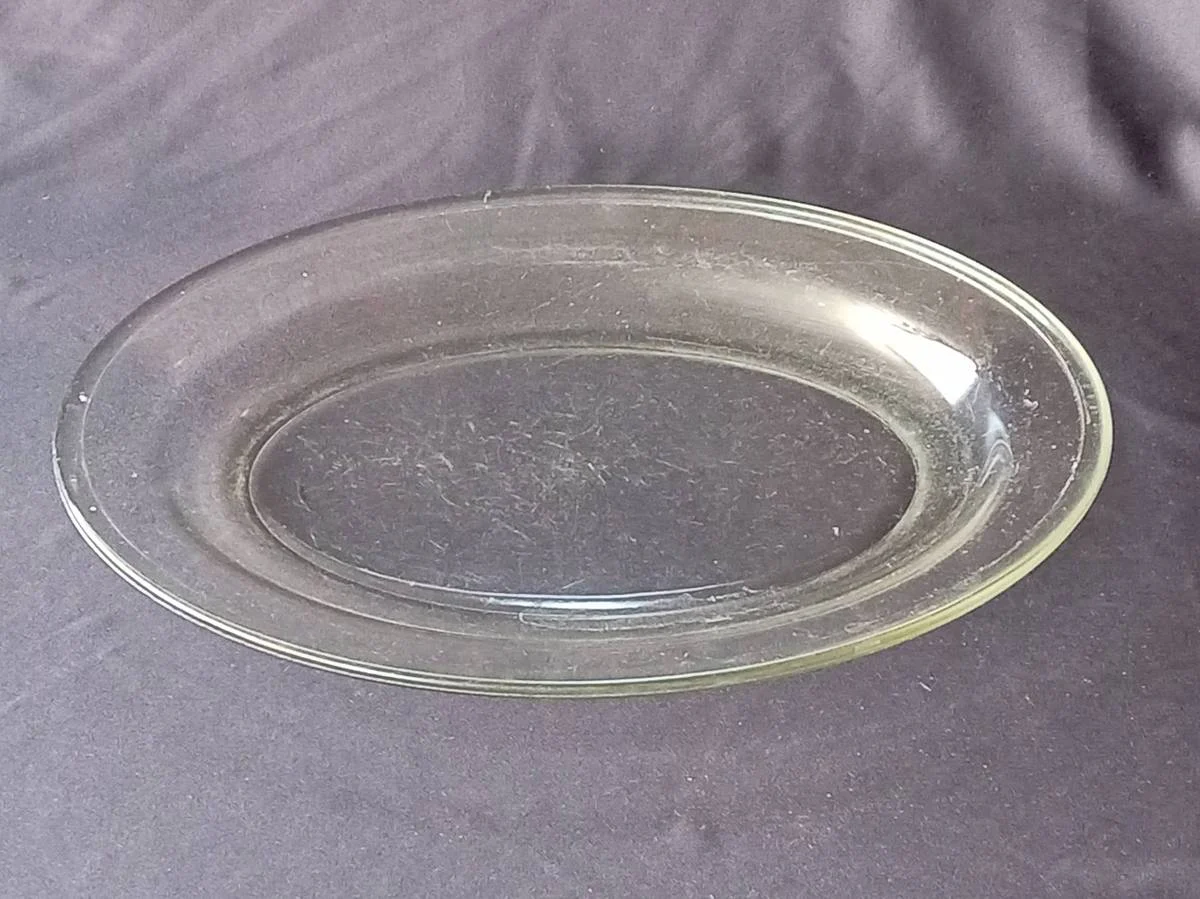 Vintage clear glass oval platter, highly characteristic of classic mid-century tempered kitchenware